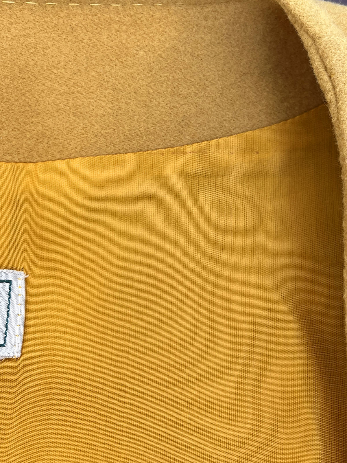 Wool collarless long coat in mustard yellow