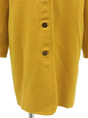 Wool collarless long coat in mustard yellow