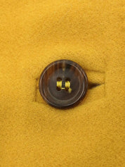 Wool collarless long coat in mustard yellow