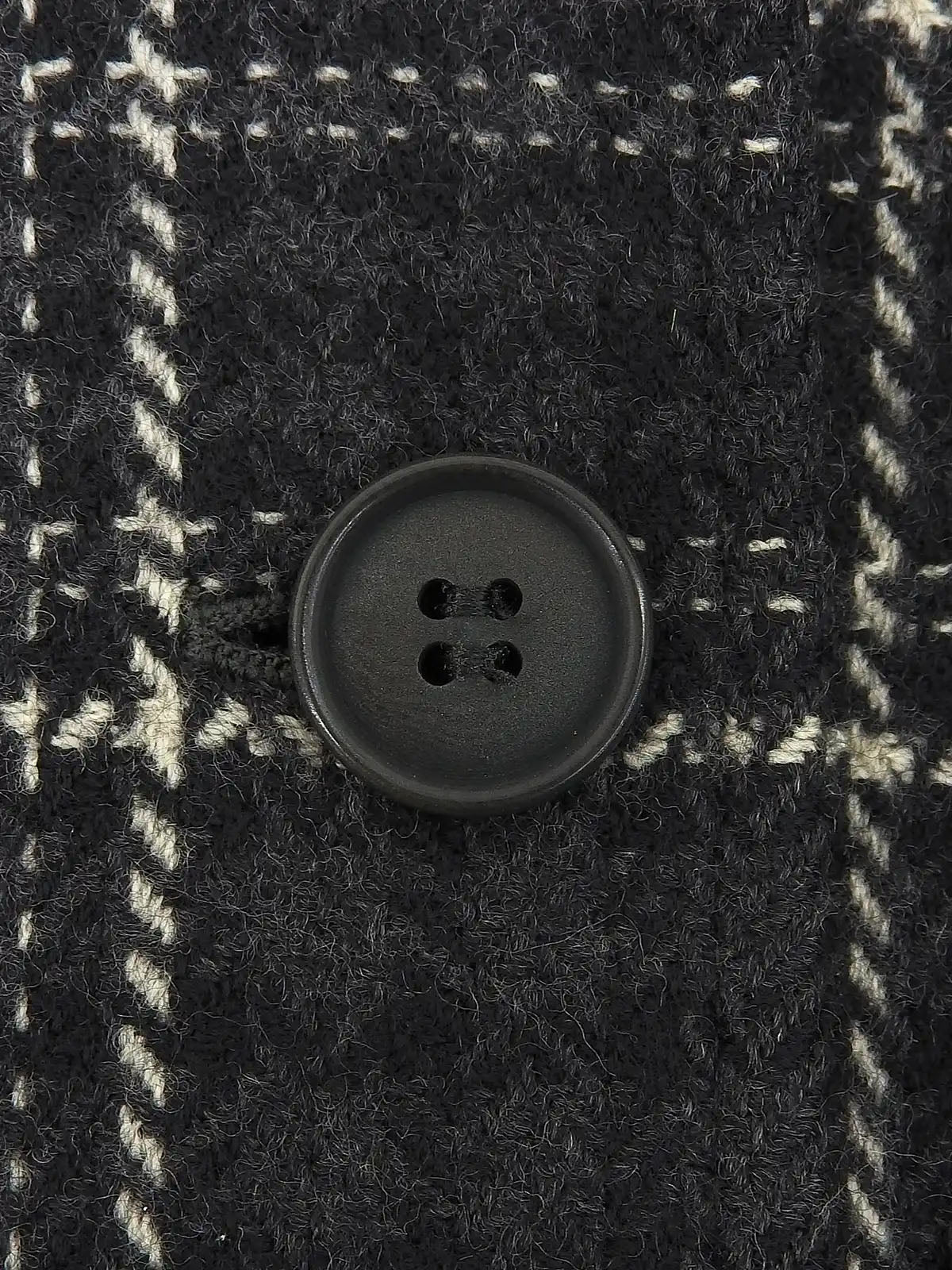 Check pattern double-breasted jacket in charcoal gray, white, and black