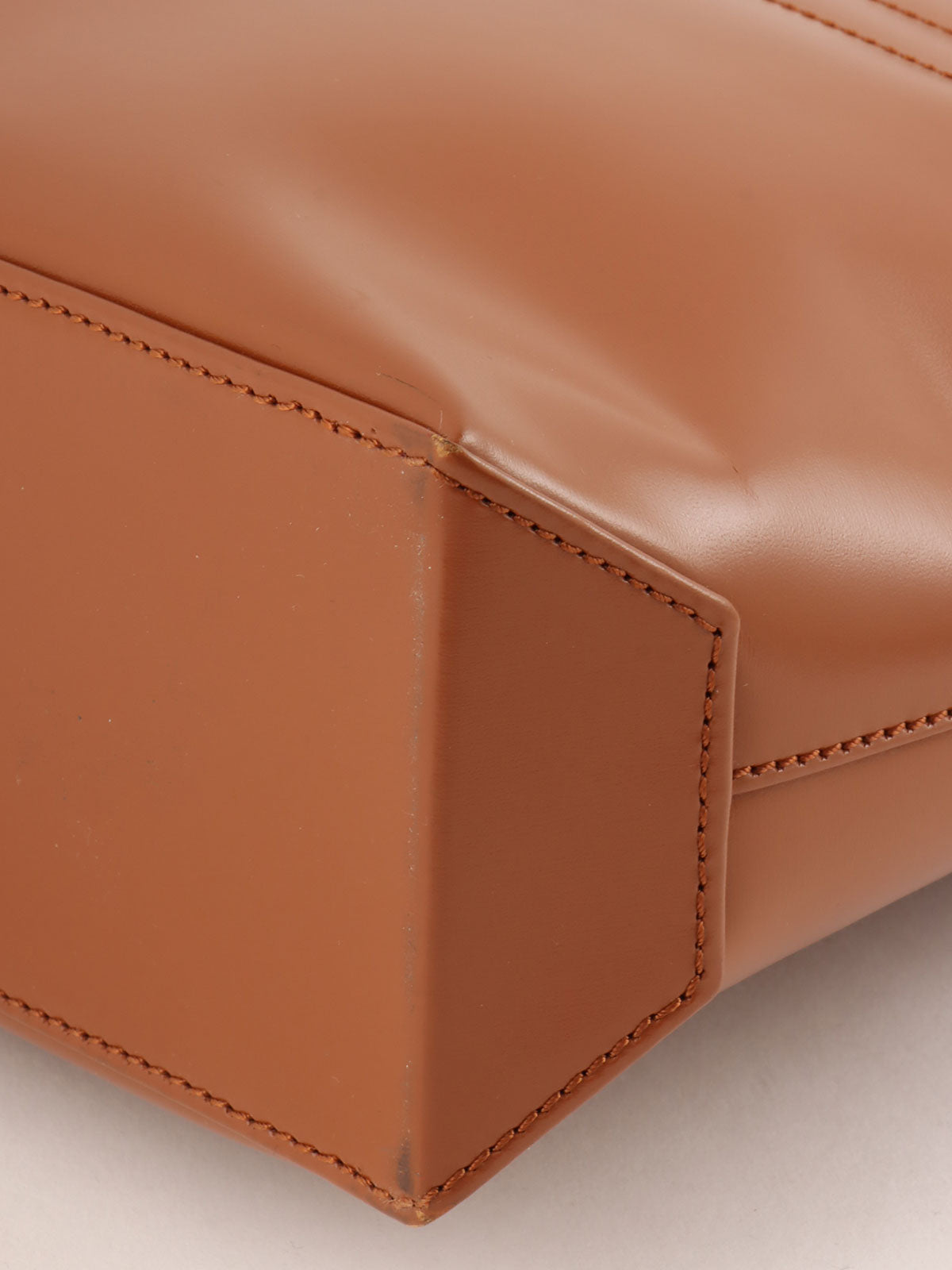 Brown logo embossed handbag