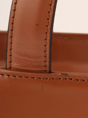 Brown logo embossed handbag