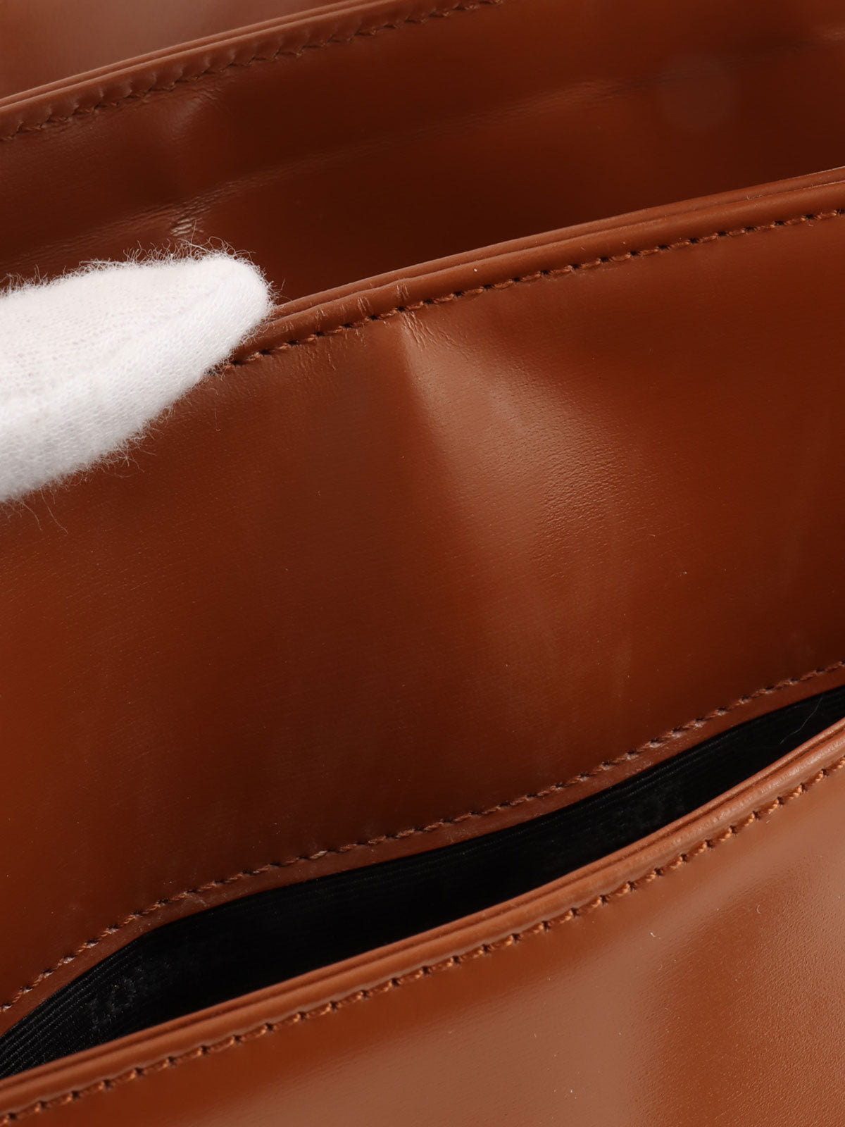 Brown logo embossed handbag