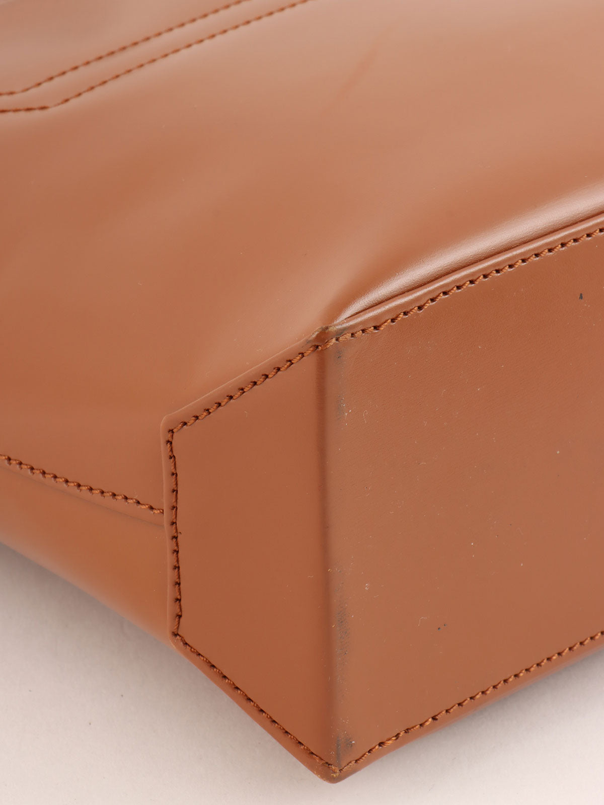 Brown logo embossed handbag