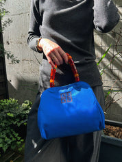 ナイロンロゴ刺繍カラーストーンハンドルバッグ ブルー/マルチ