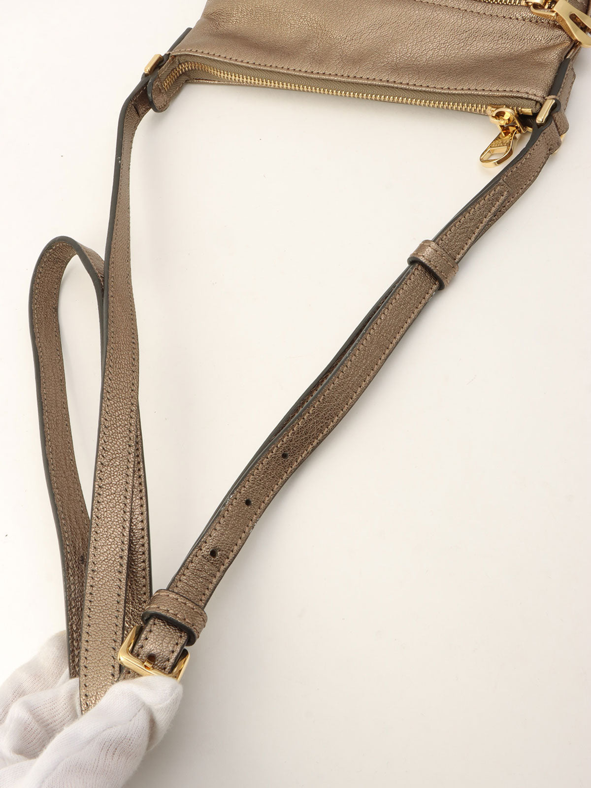 Anagram Embossed Shoulder Bag Metallic Grey