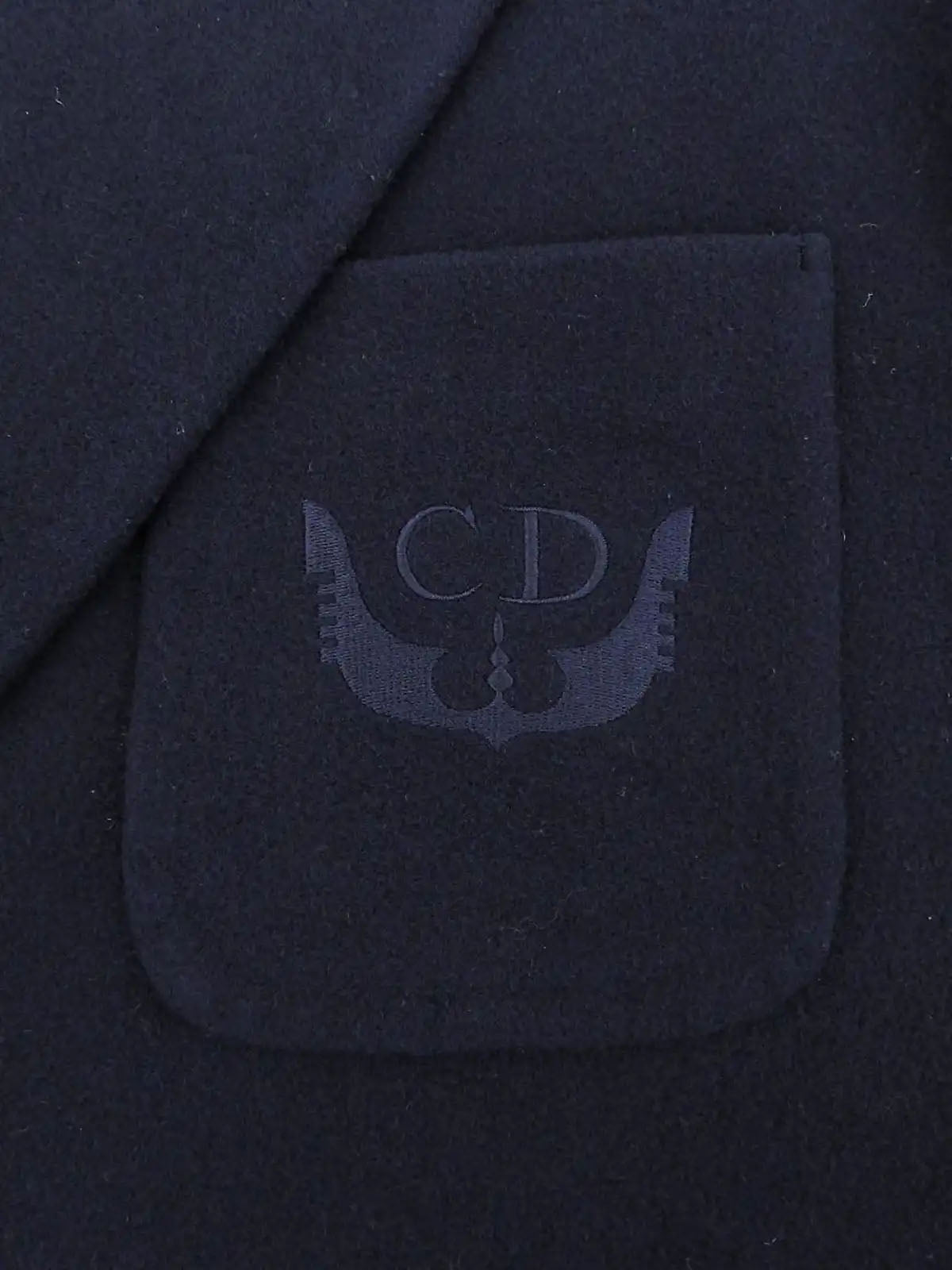 Navy wool jacket with embroidered logo emblem