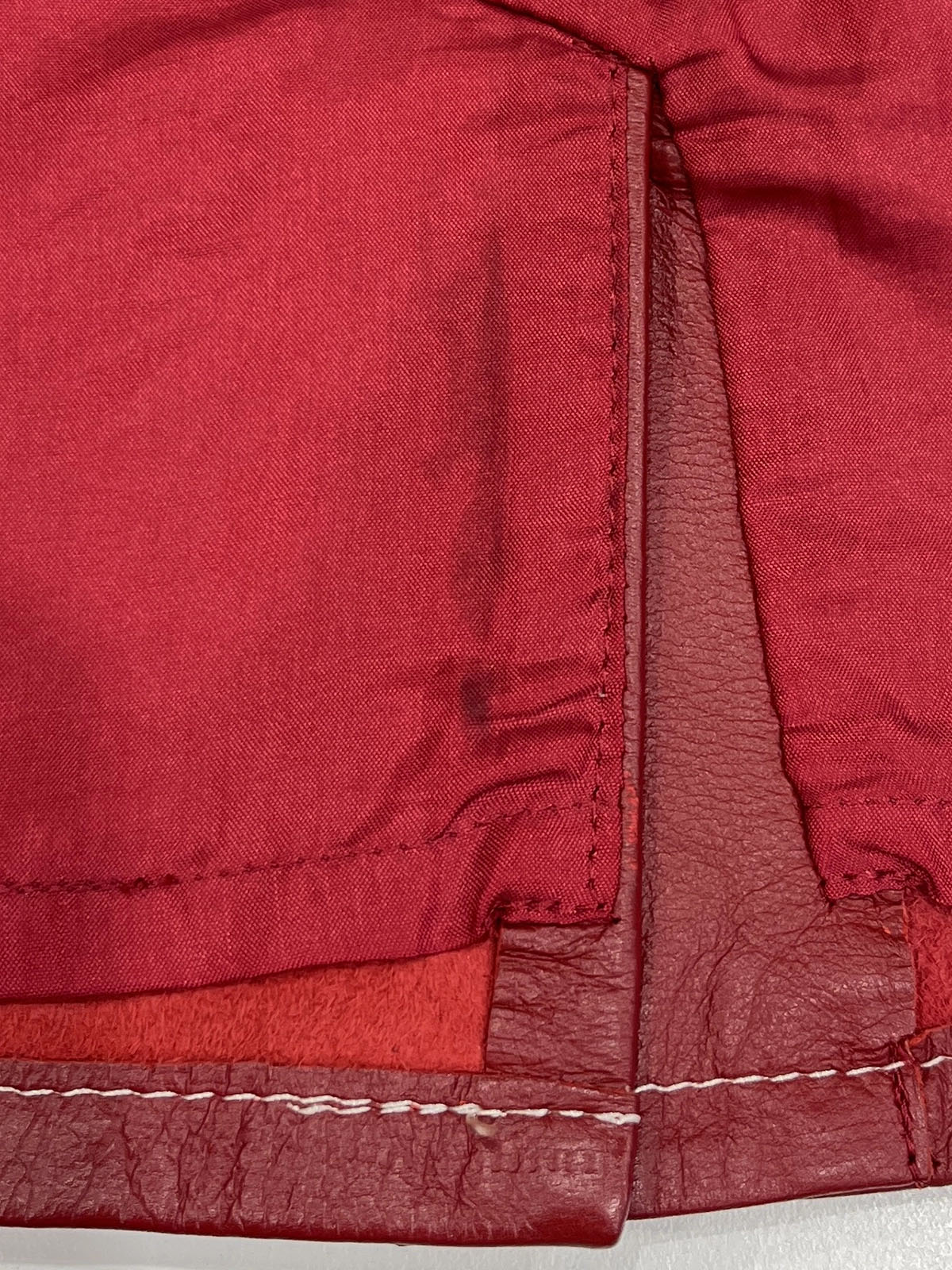 Leather logo plate mini skirt in burgundy