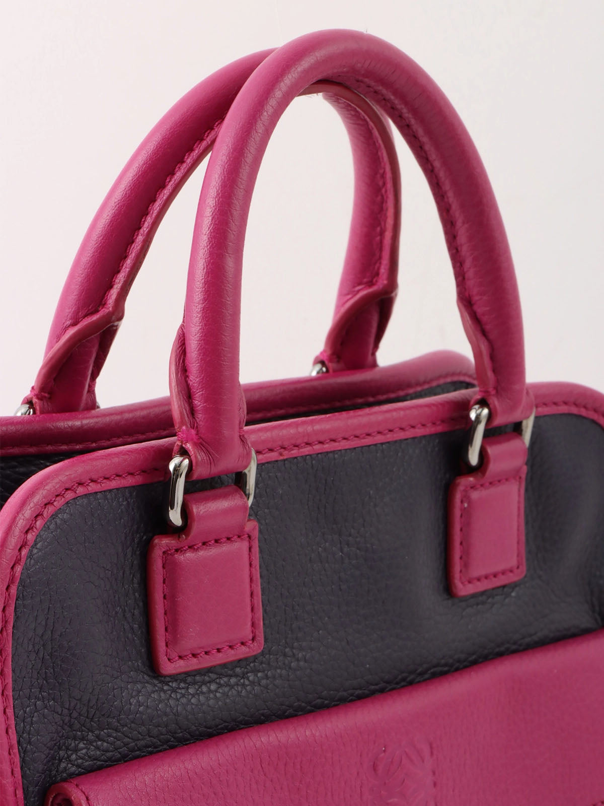 Anagram Cruz 2-way bag in dark purple and fuchsia pink