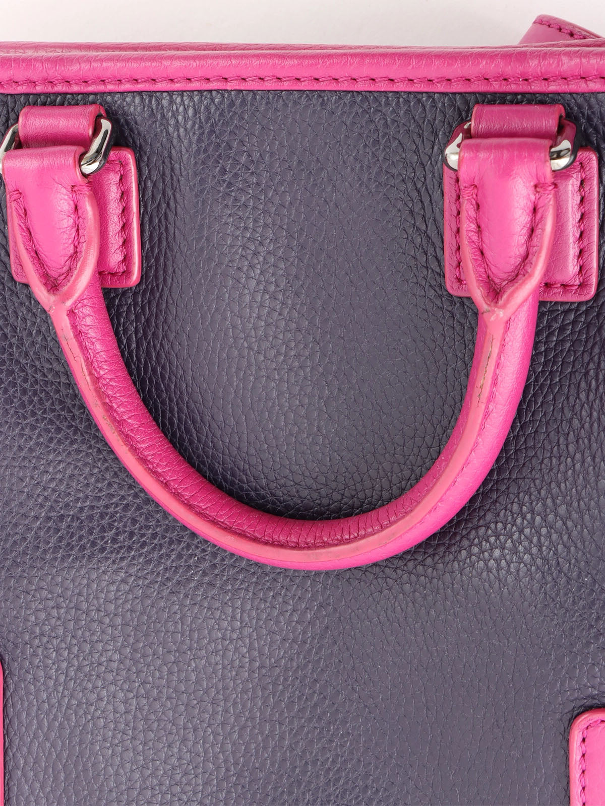 Anagram Cruz 2-way bag in dark purple and fuchsia pink