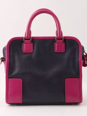 Anagram Cruz 2-way bag in dark purple and fuchsia pink
