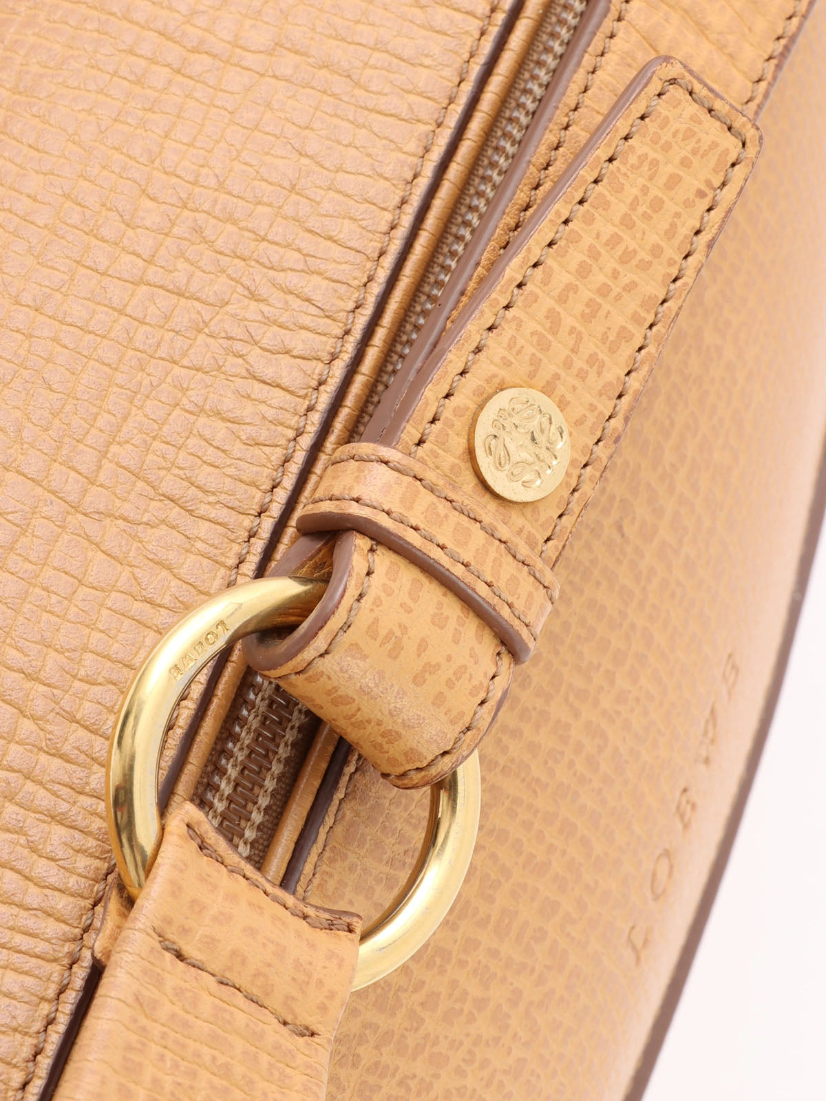 Logo embossed shoulder bag in beige