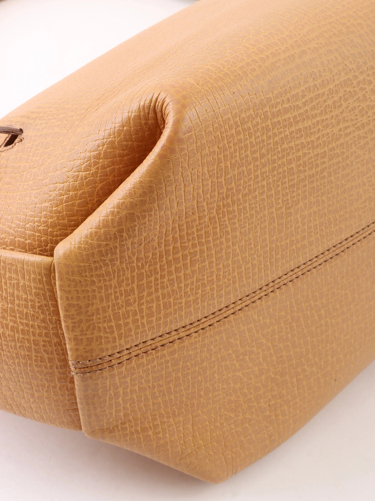 Logo embossed shoulder bag in beige