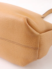 Logo embossed shoulder bag in beige
