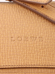 Logo embossed shoulder bag in beige