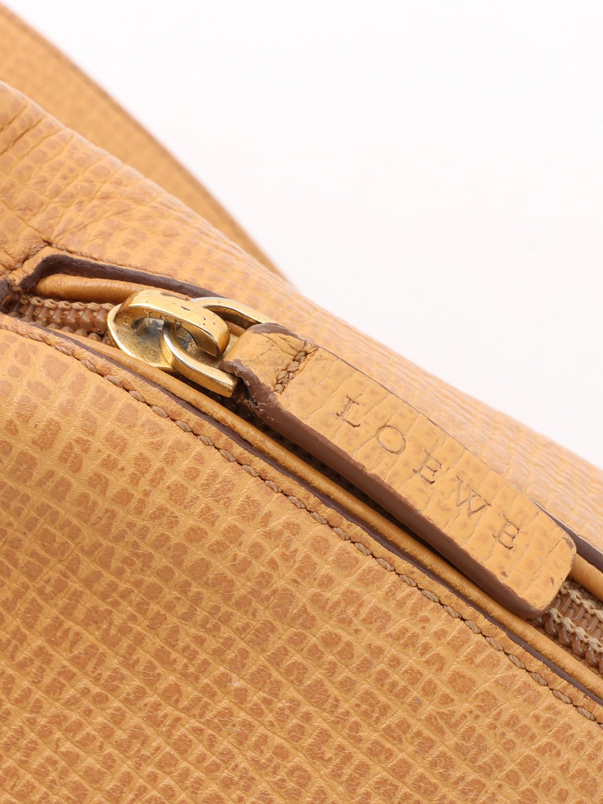 Logo embossed shoulder bag in beige