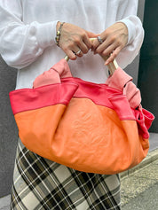 Nappa Aire handbag in orange, pink, and metallic gold