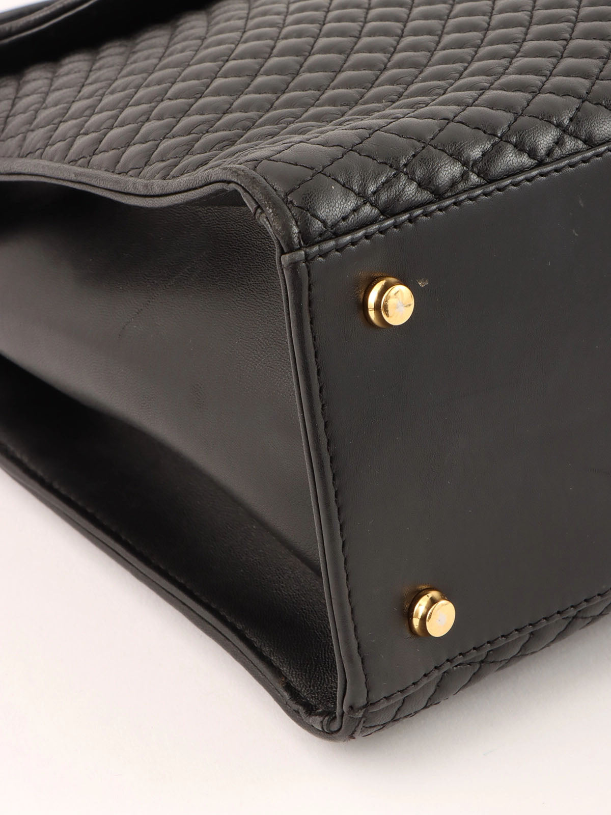 Logo plaque quilted handbag in black