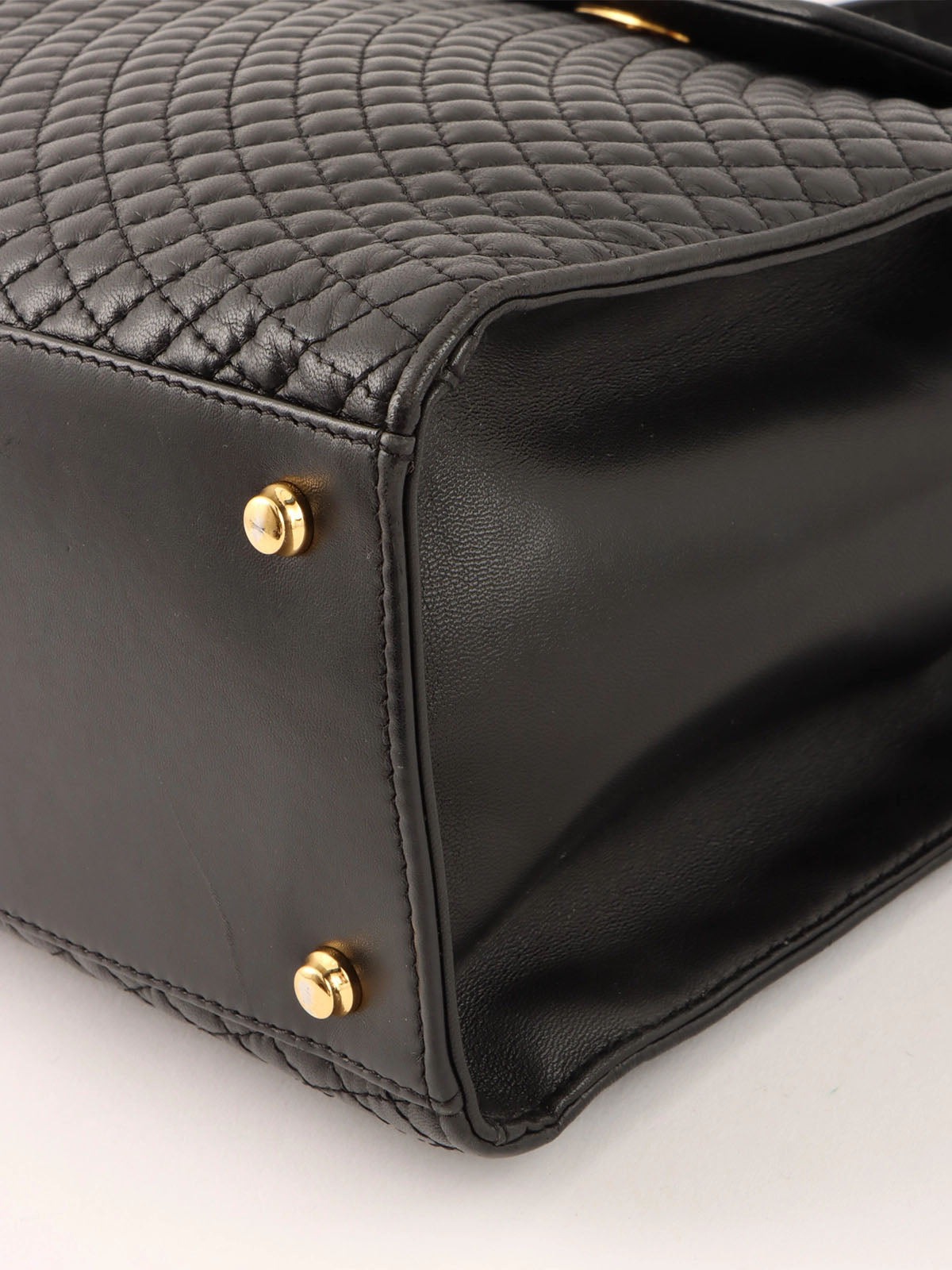Logo plaque quilted handbag in black