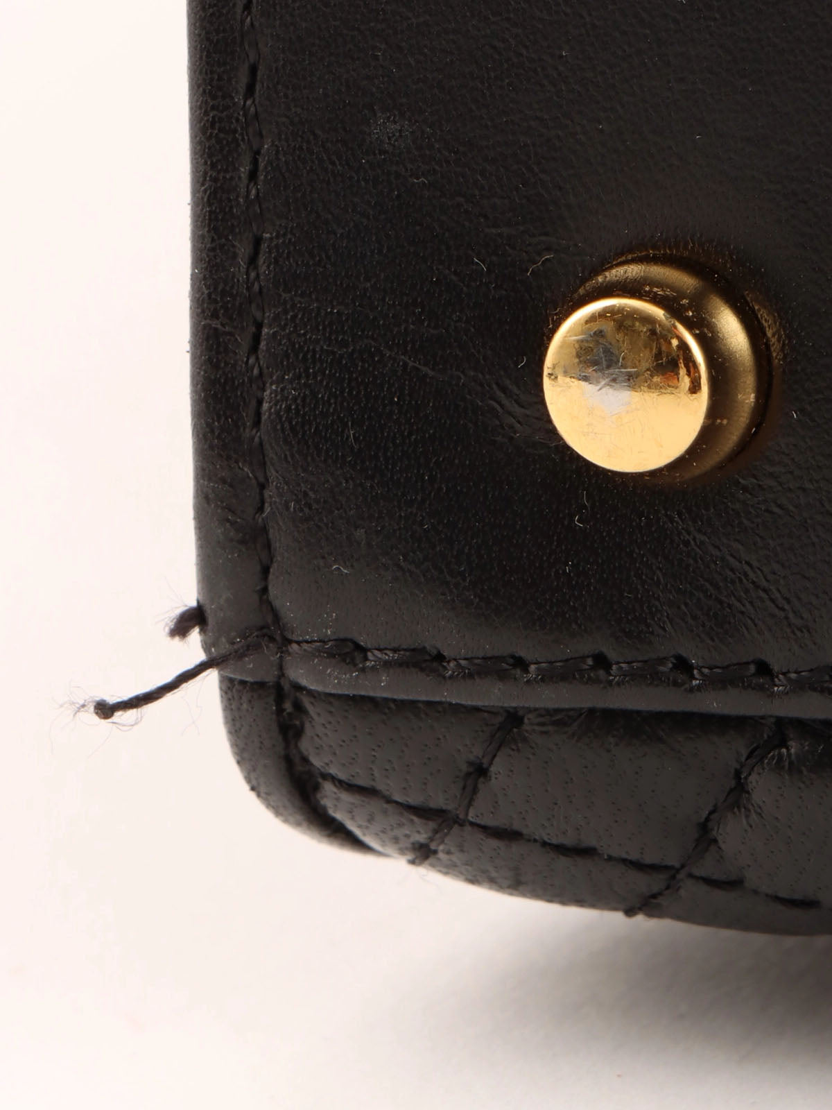 Logo plaque quilted handbag in black
