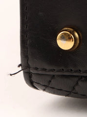 Logo plaque quilted handbag in black