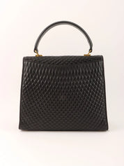 Logo plaque quilted handbag in black