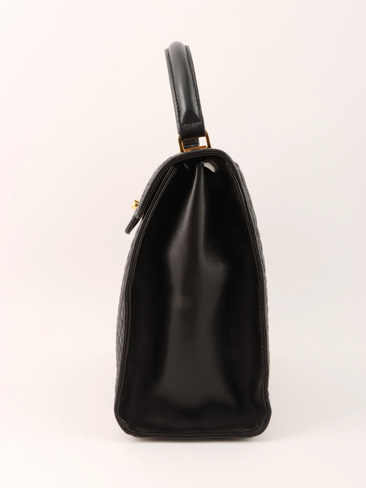 Logo plaque quilted handbag in black