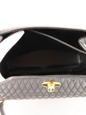 Logo plaque quilted handbag in black