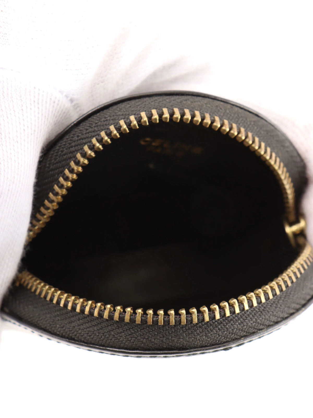 黑色圆形硬币盒，带标志牌