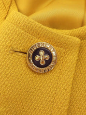 Wool design logo button collarless jacket in mustard