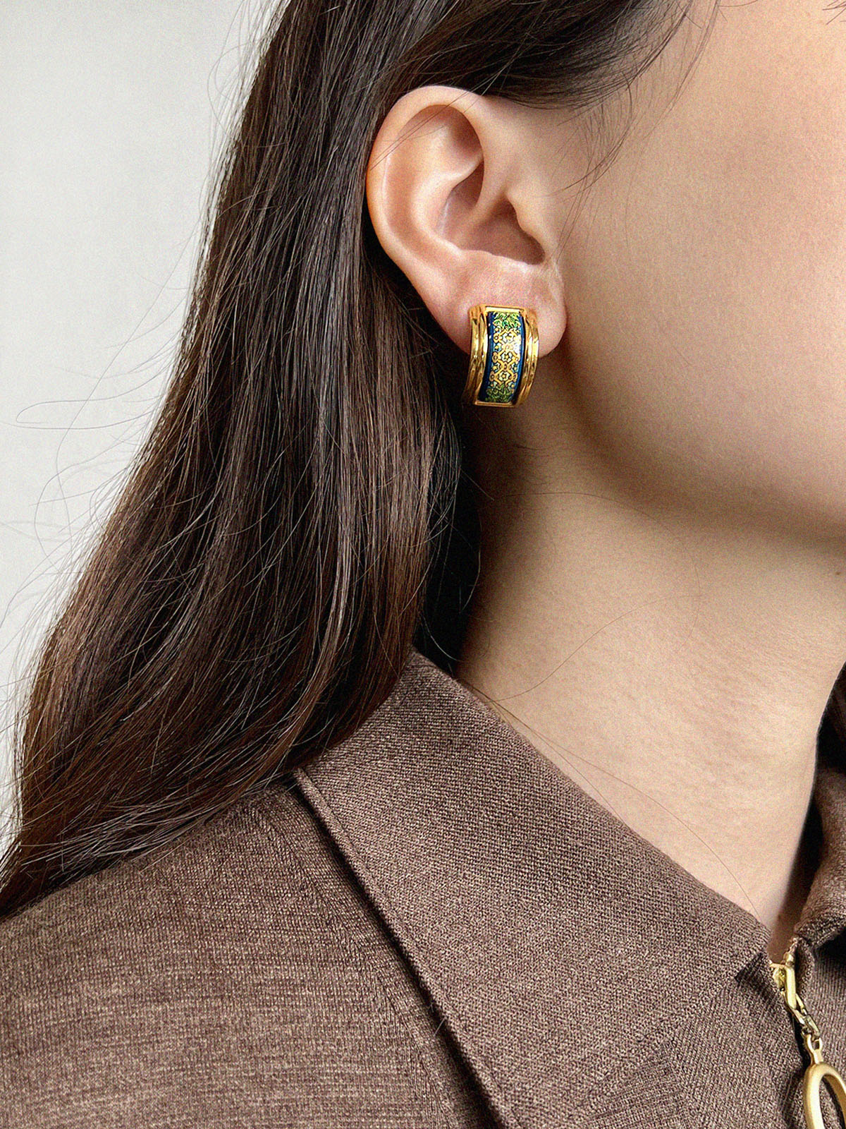 Enameled earrings in gold, green, and blue