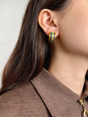 Enameled earrings in gold, green, and blue