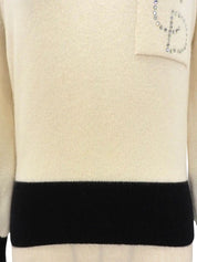 Two-tone rhinestone logo long sleeve knit top in ivory/black