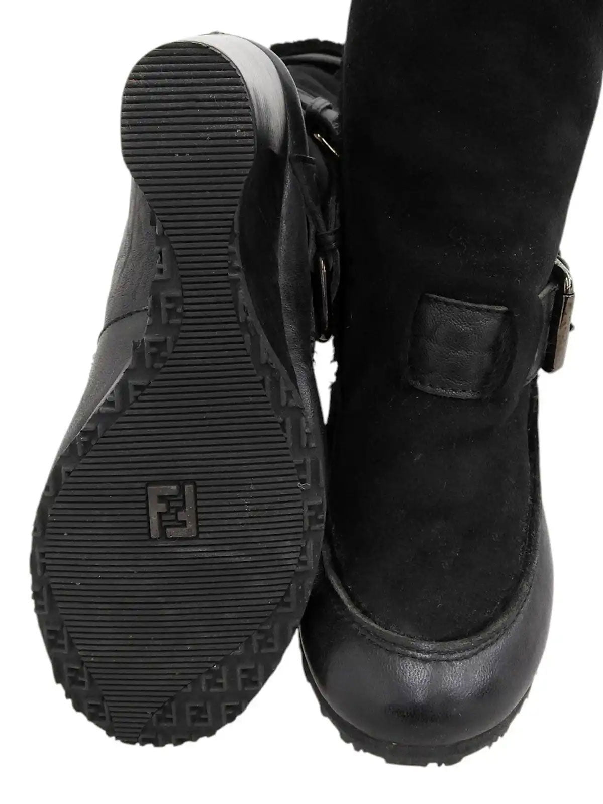 Black sheepskin logo buckle wedge sole boots