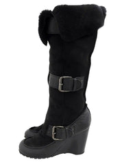 Black sheepskin logo buckle wedge sole boots