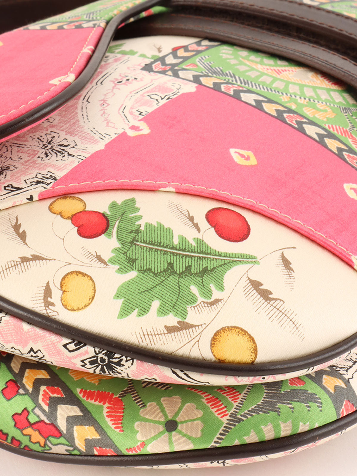 Paisley pattern saddlebag in pink, green, and white