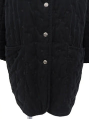 Serie Button Quilted Coat in Black