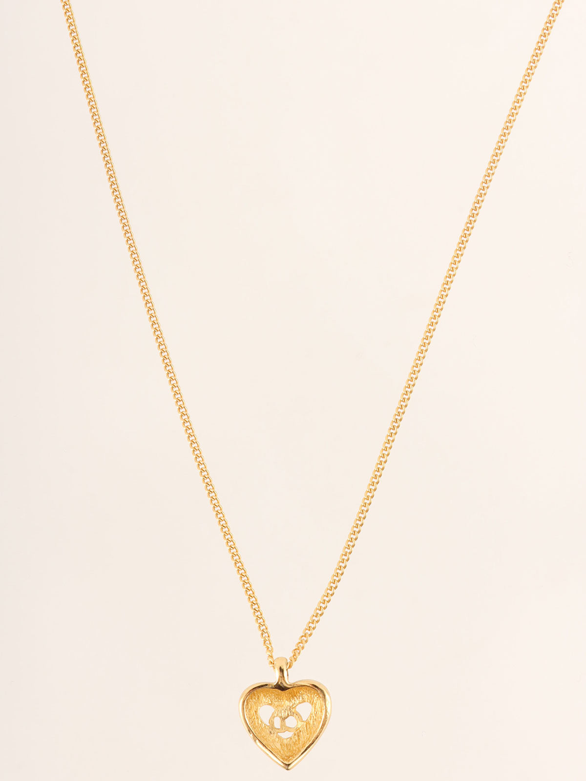 Heart motif logo cutout necklace in gold