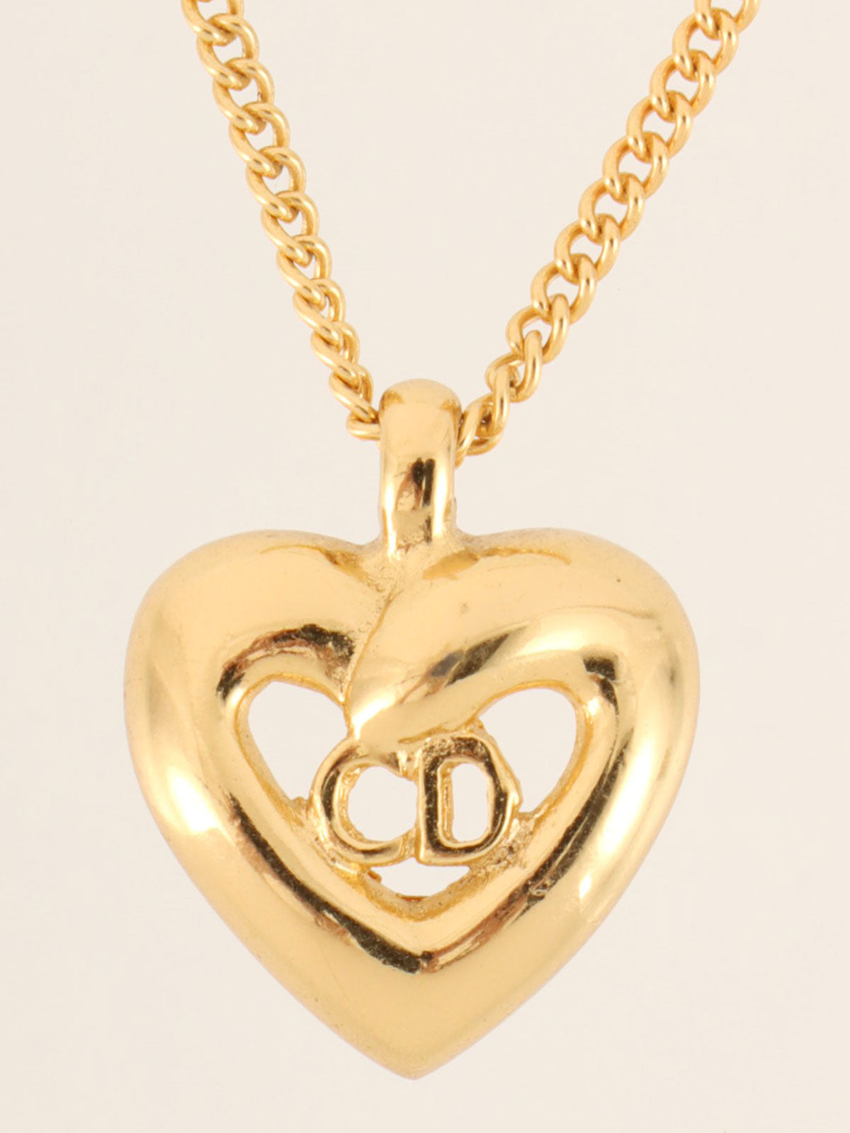 Heart motif logo cutout necklace in gold