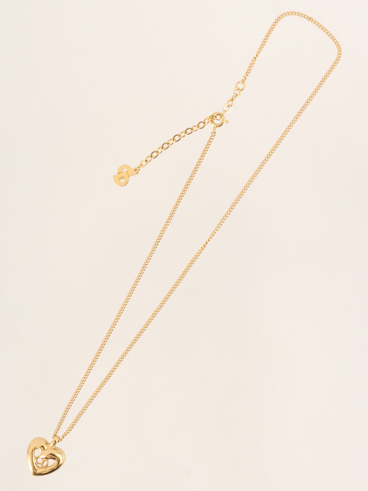 Heart motif logo cutout necklace in gold