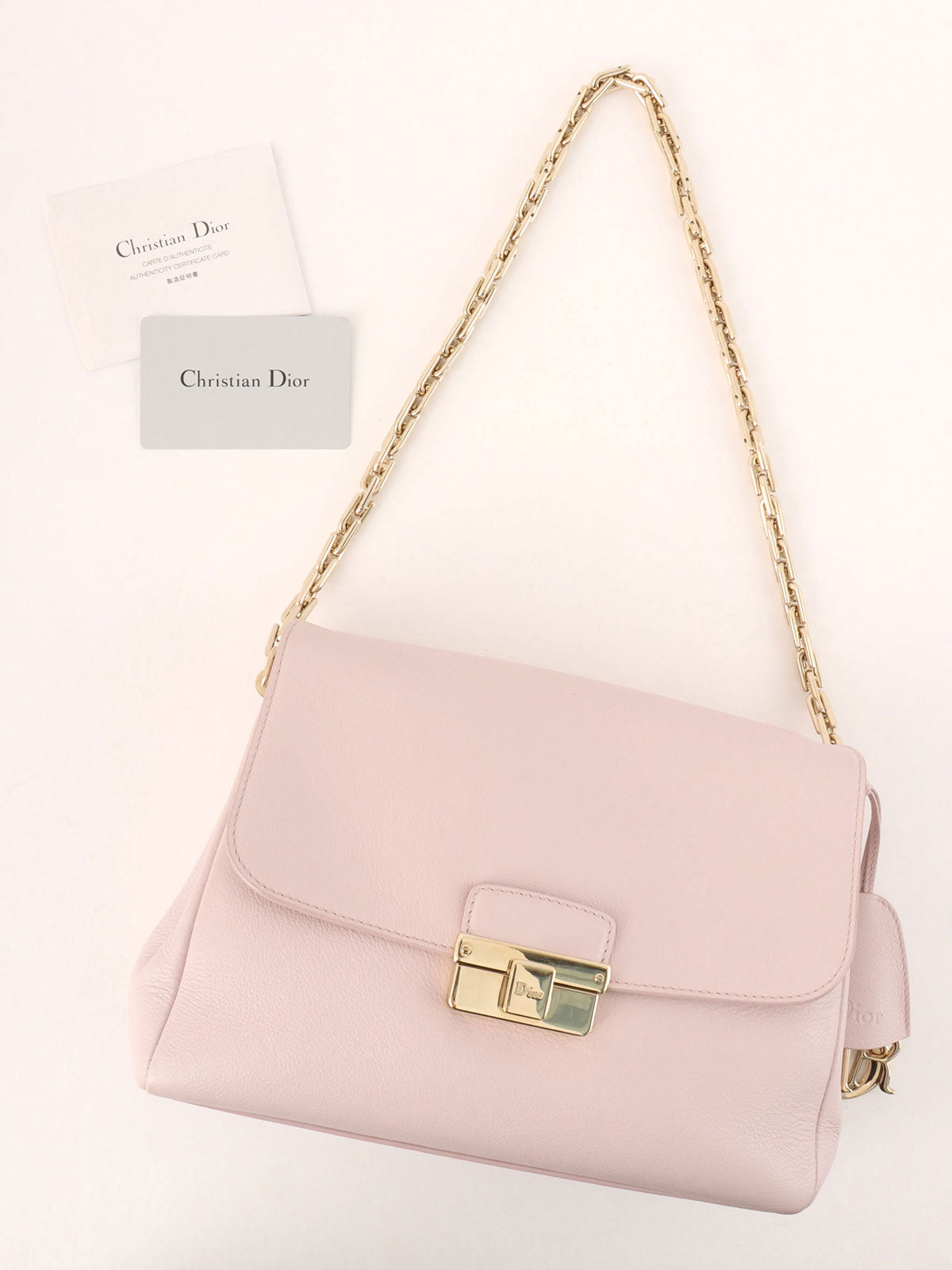 Leather logo plate chain shoulder bag in baby pink