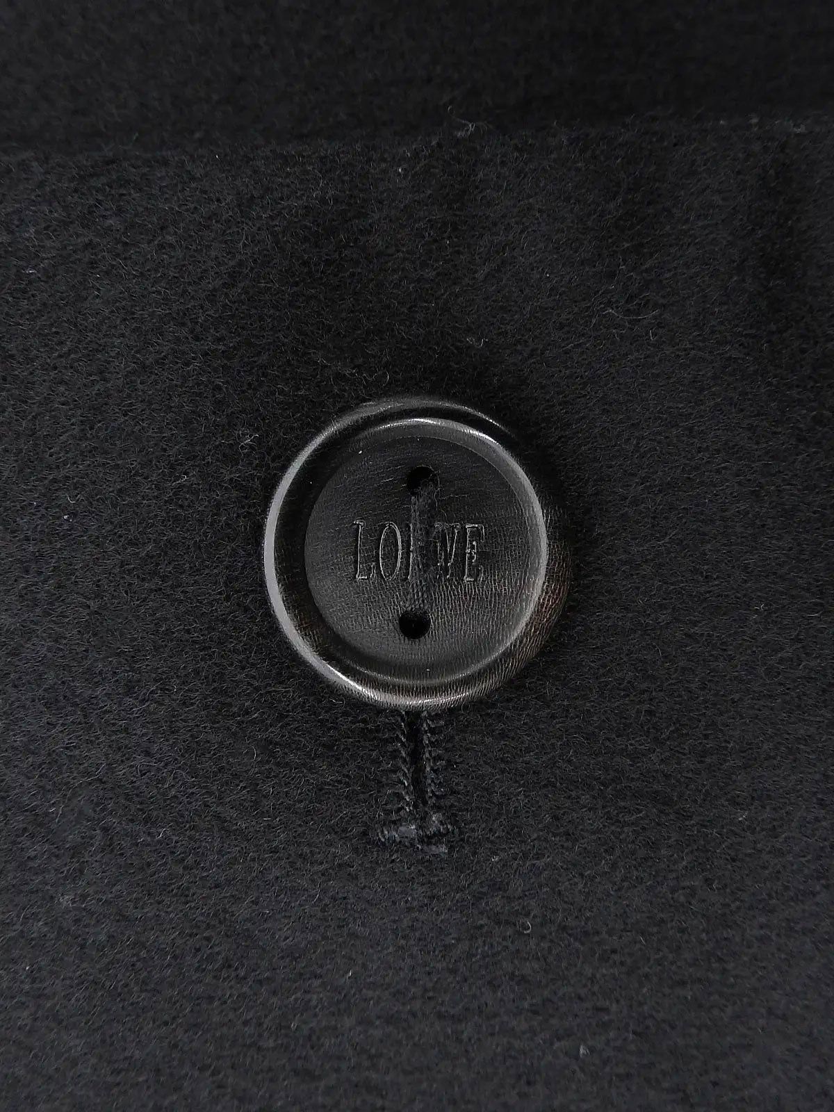 Wool logo button collarless jacket in black