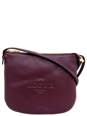 Logo embossed shoulder bag in Bordeaux