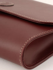 Logo embossed clutch bag in burgundy