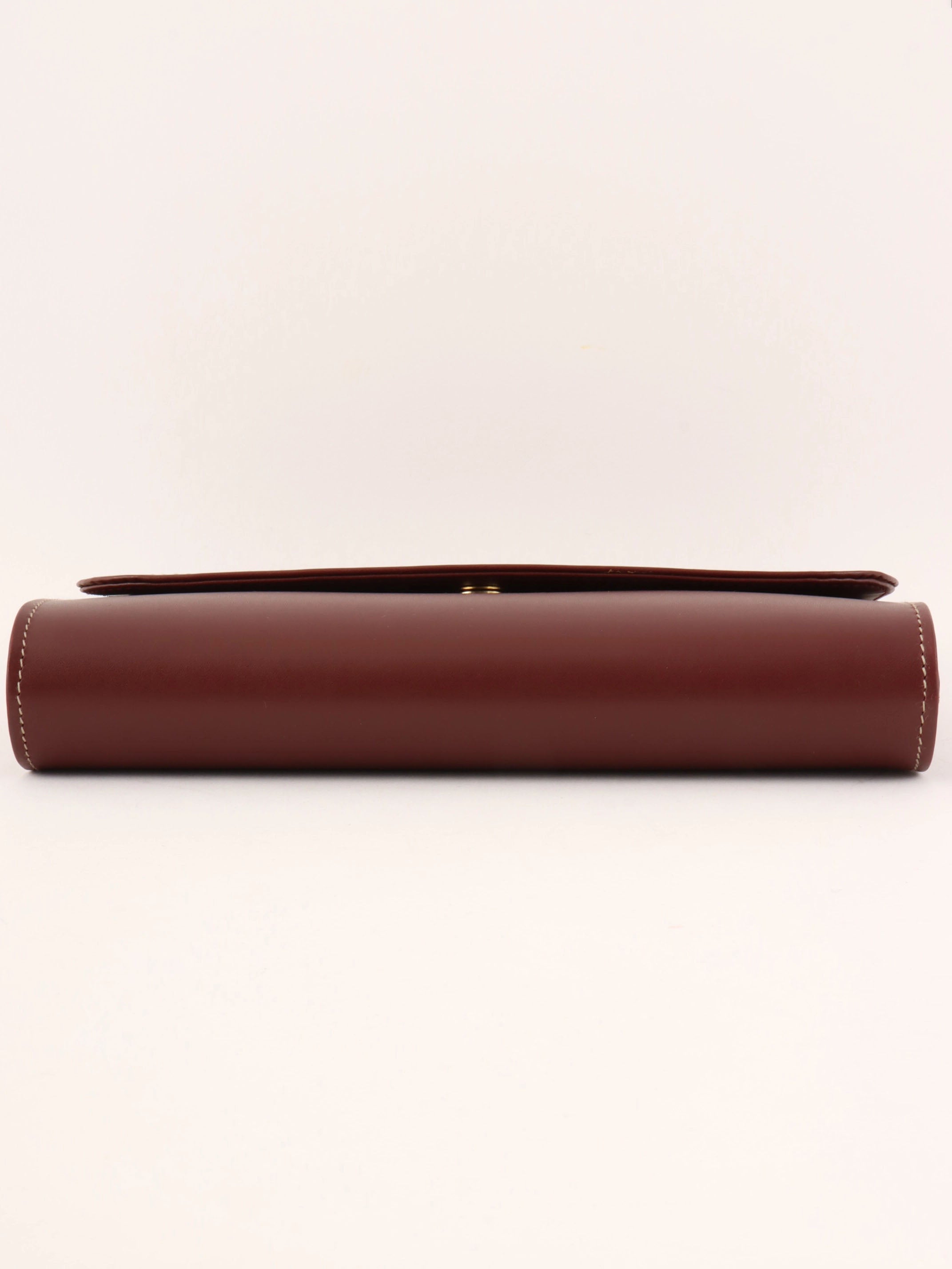 Logo embossed clutch bag in burgundy