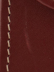 Logo embossed clutch bag in burgundy