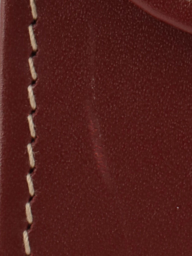 Logo embossed clutch bag in burgundy