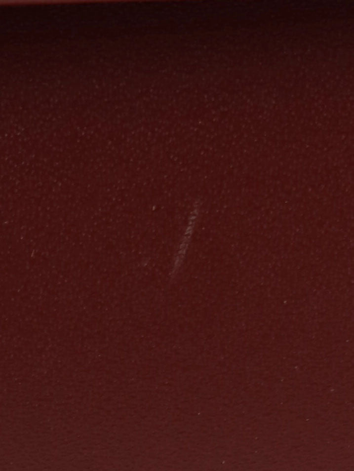 Logo embossed clutch bag in burgundy