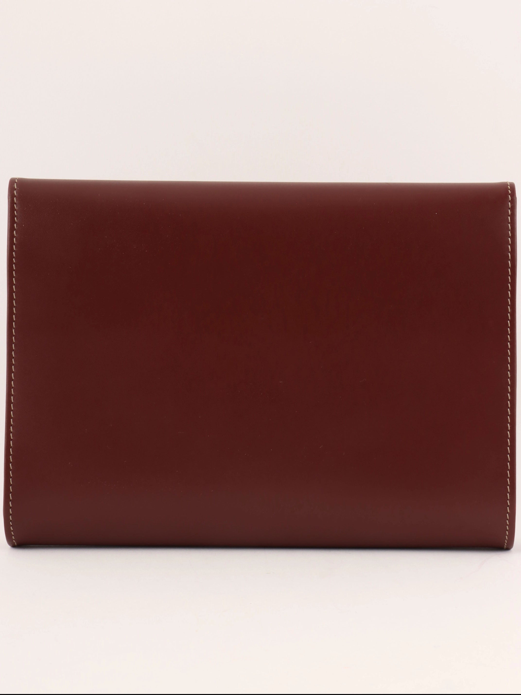 Logo embossed clutch bag in burgundy