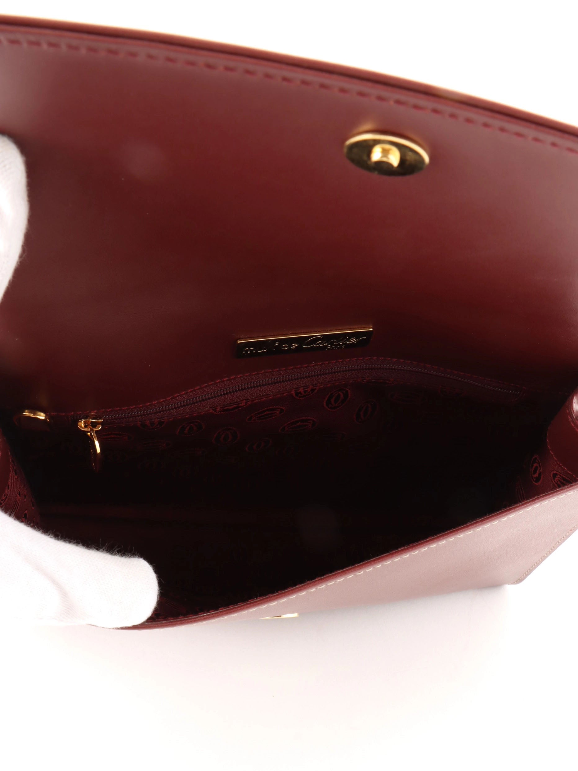 Logo embossed clutch bag in burgundy